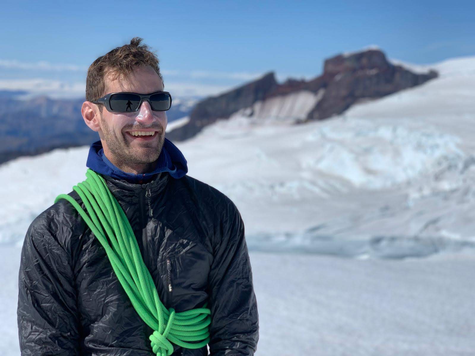 Dr. Gareth Shellard on a mountain summit